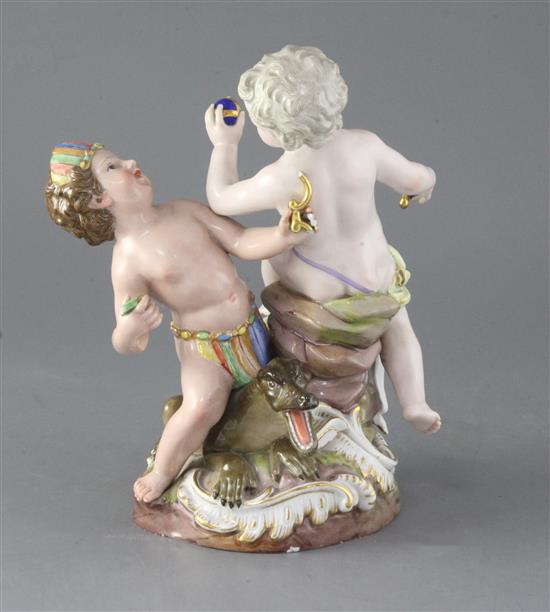 A Meissen group of two putti emblematic of Europe and America, height 24.3cm, losses